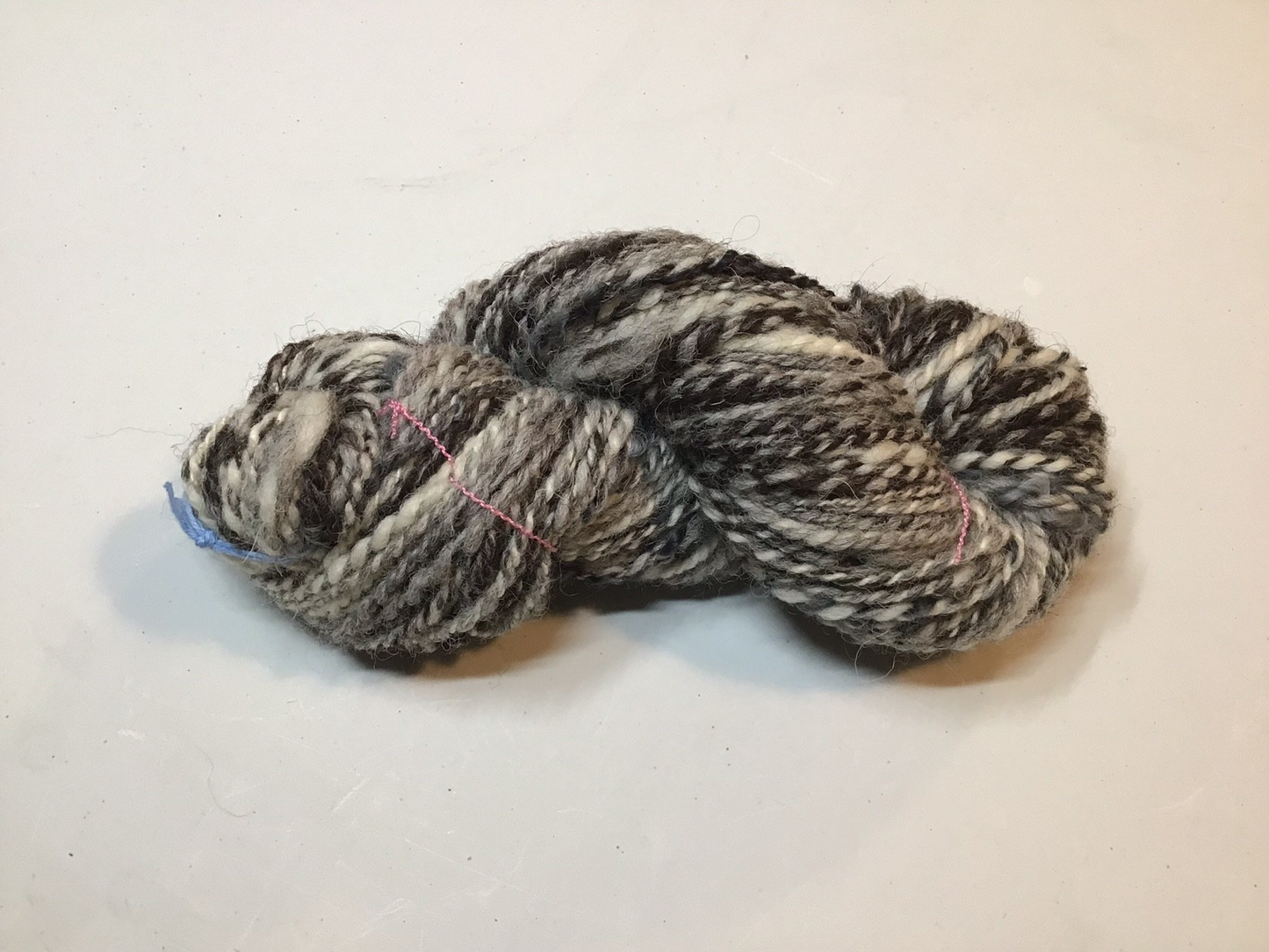 Auspicious Stitch - Handspun black Welsh Mountain, Shetland and Cheviot wool with added hand-dyed curly locks - 60g
